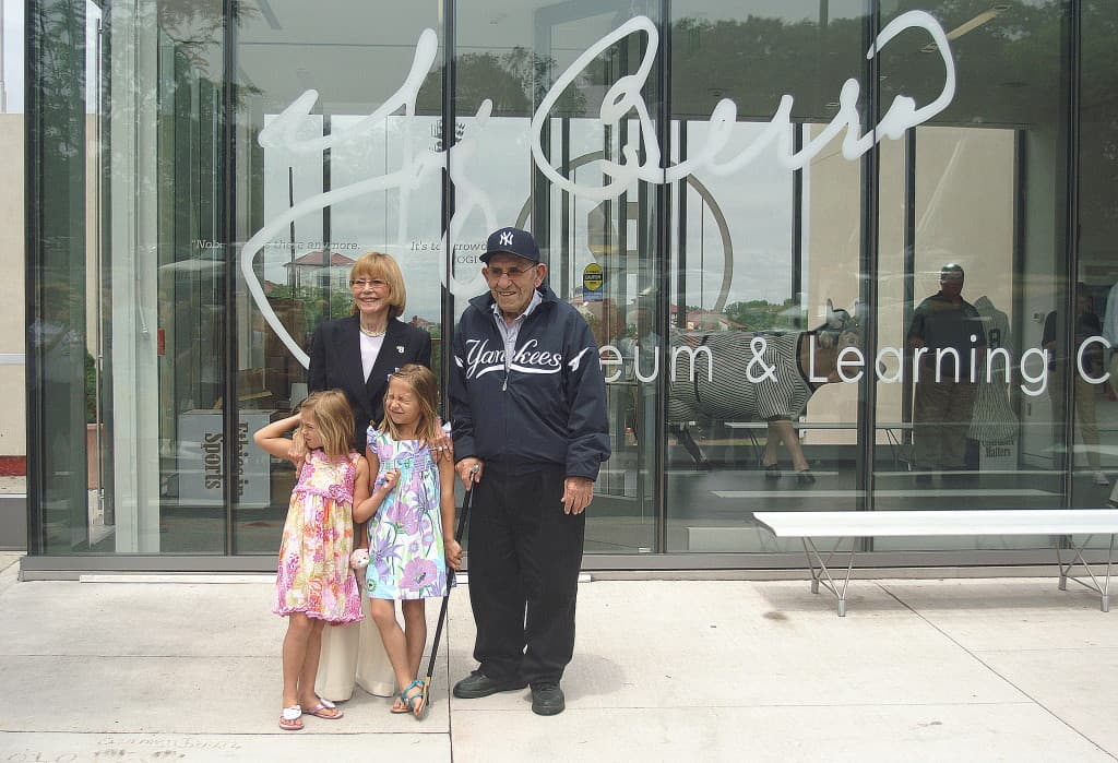Carmen and Yogi Berra, with their granddaughters, at the reopening of the Yogi Berra Museum and Learning Center.