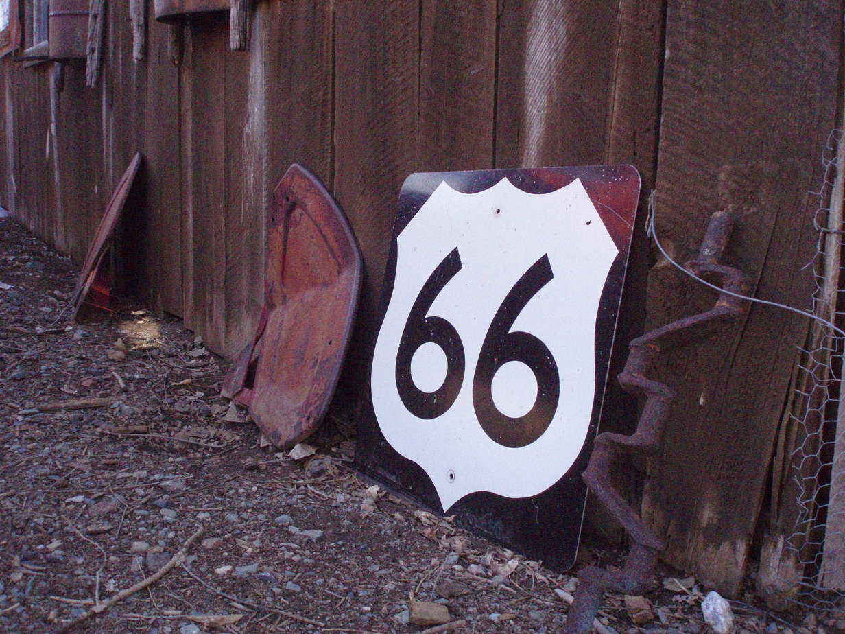 Route 66 shield in a junkyard